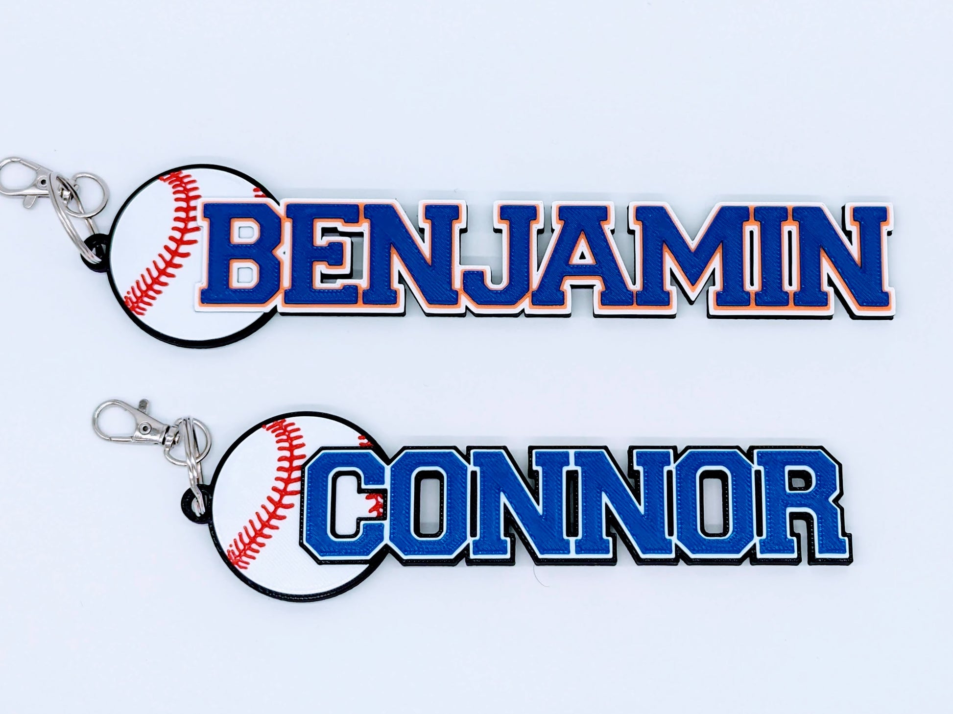 Bright blue and purple baseball bag tag with custom engraved player number and name, ready to clip onto any sports bag.