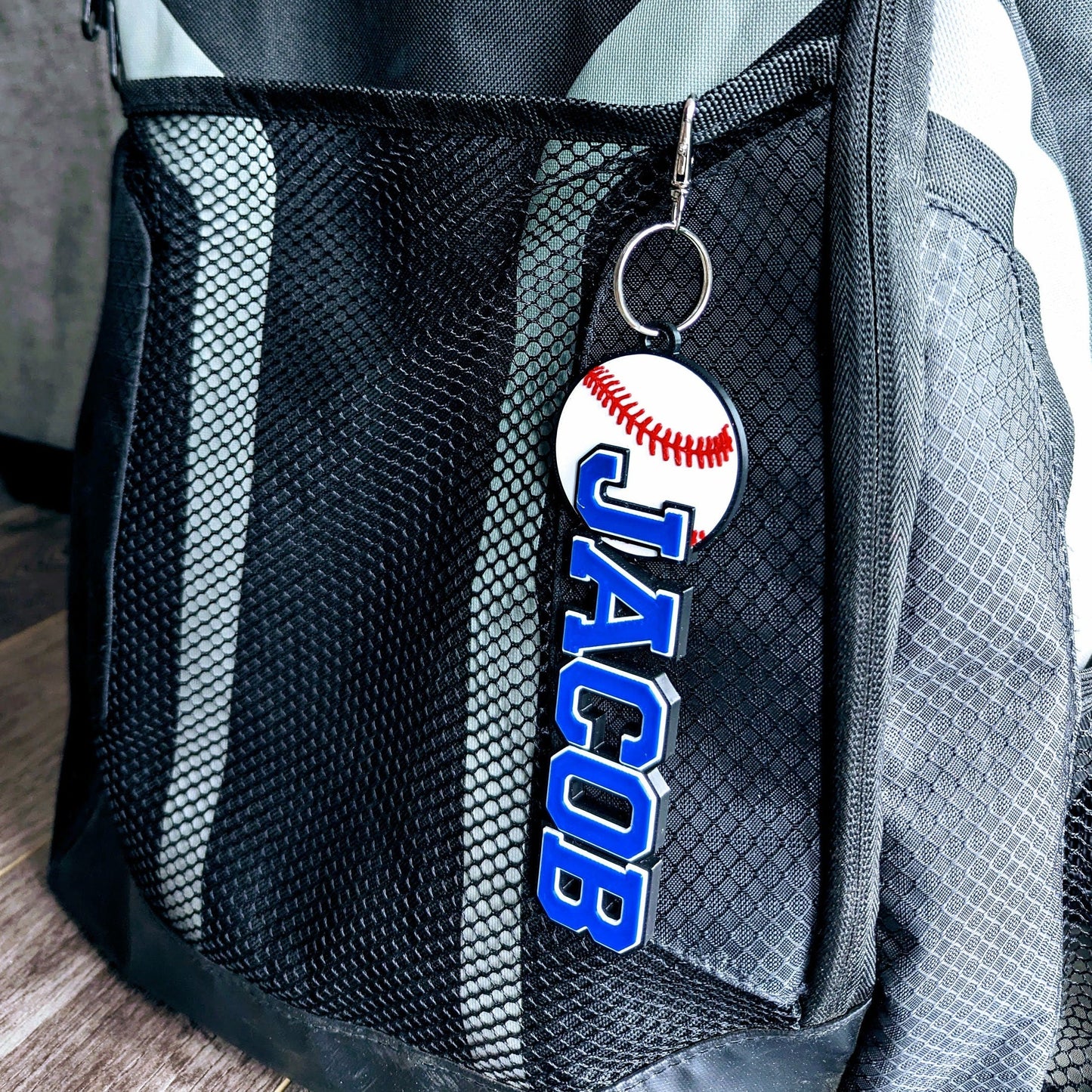 Durable, blue-themed baseball bag tag with white lettering, showcasing team name and player position.